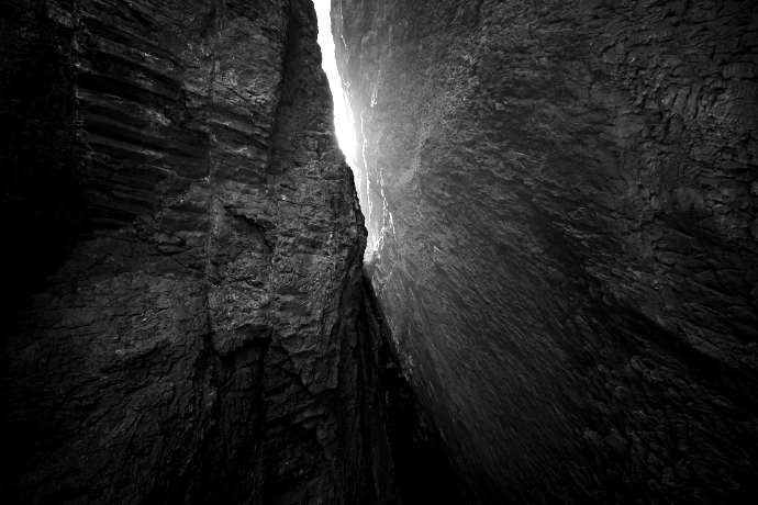 a narrow passage between two large rocks